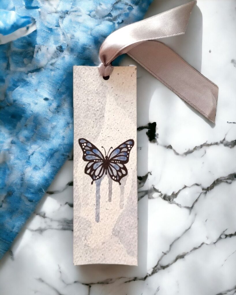 Silvery Flutter hand-painted blue butterfly bookmark with satin ribbon by Mimi's Art Nook